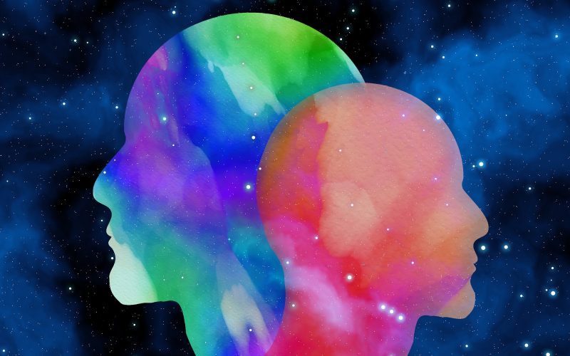 two head silhouettes with space background